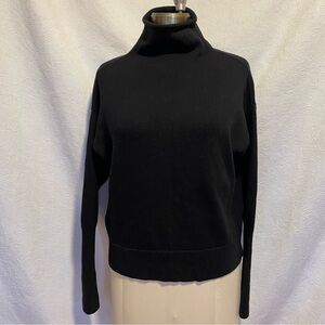Wilfred L black merino wool funnel neck.
